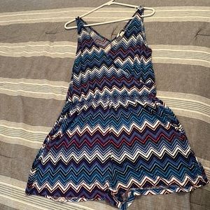 Soft romper. Would be perfect for a beach coverup. Size M. Has pockets!